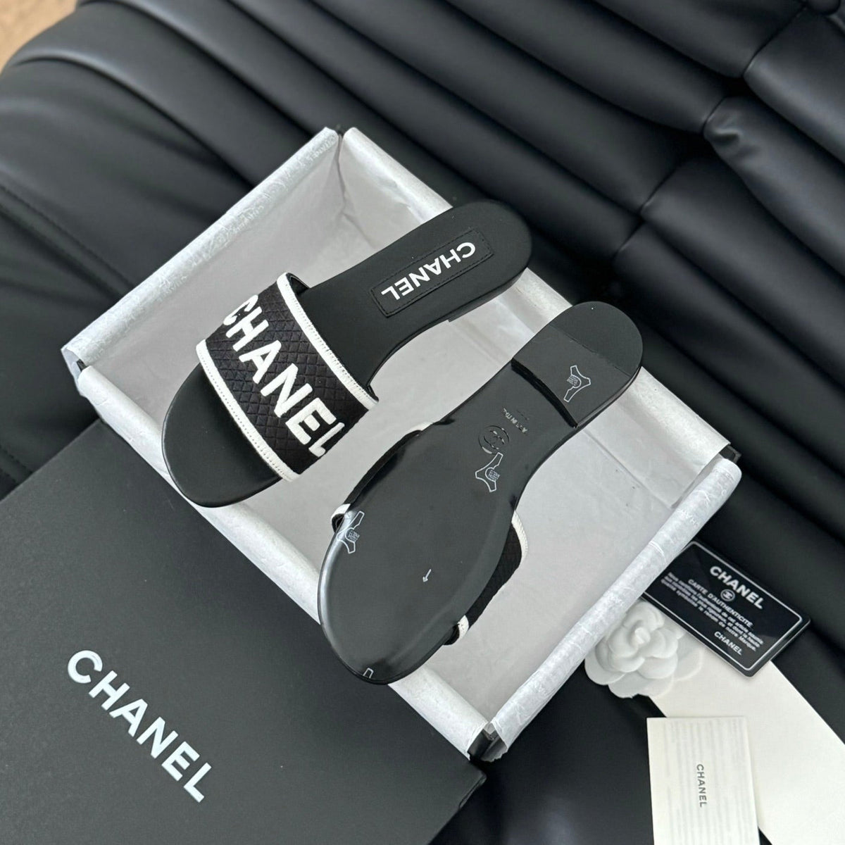 CHANEL Woven Embroidered Letter Slippers Black White
