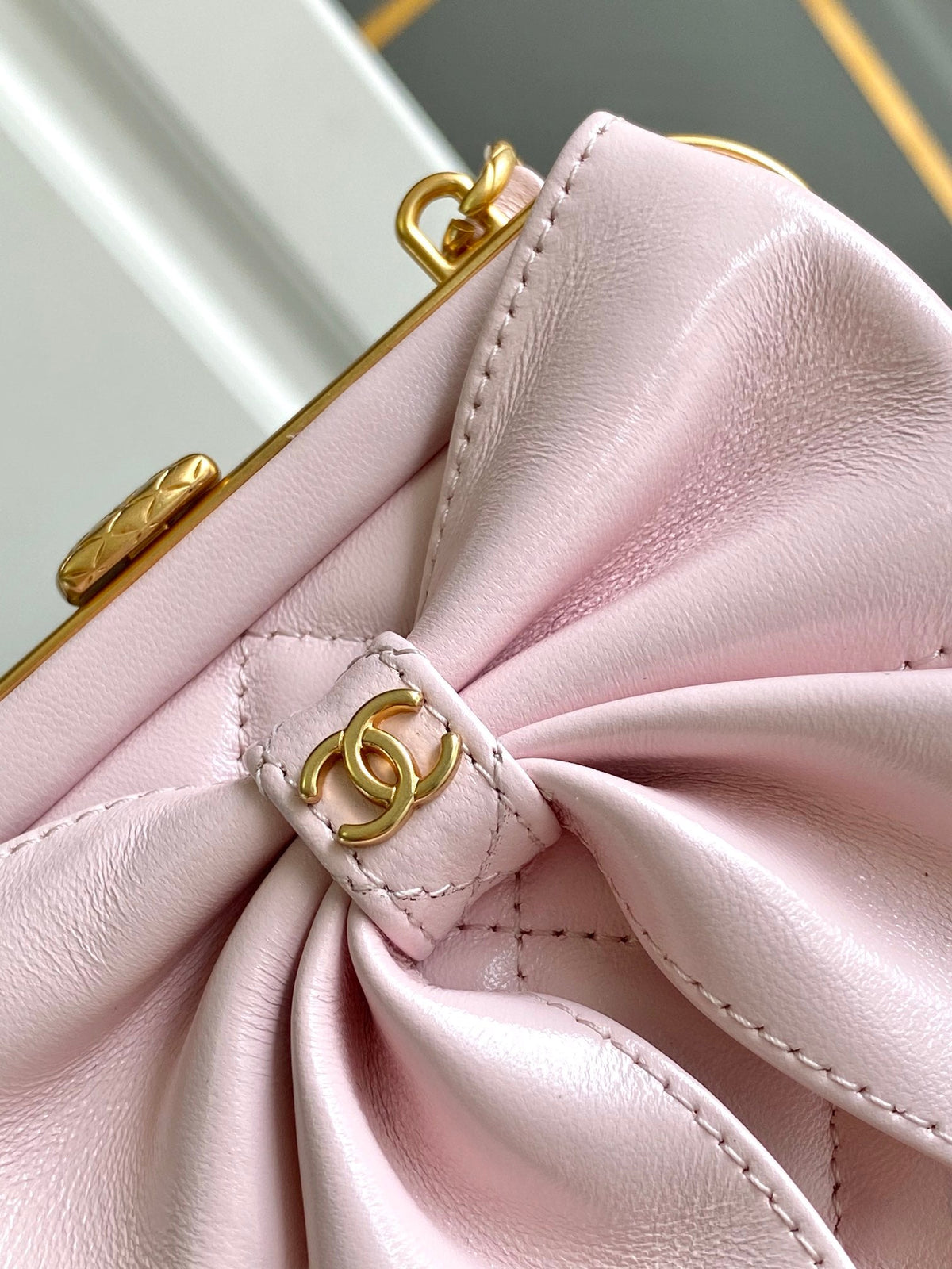 CHANEL MINI 13 CLUTCH WITH STRAP IN LIGHT PINK LAMBSKIN ATTACH BOW