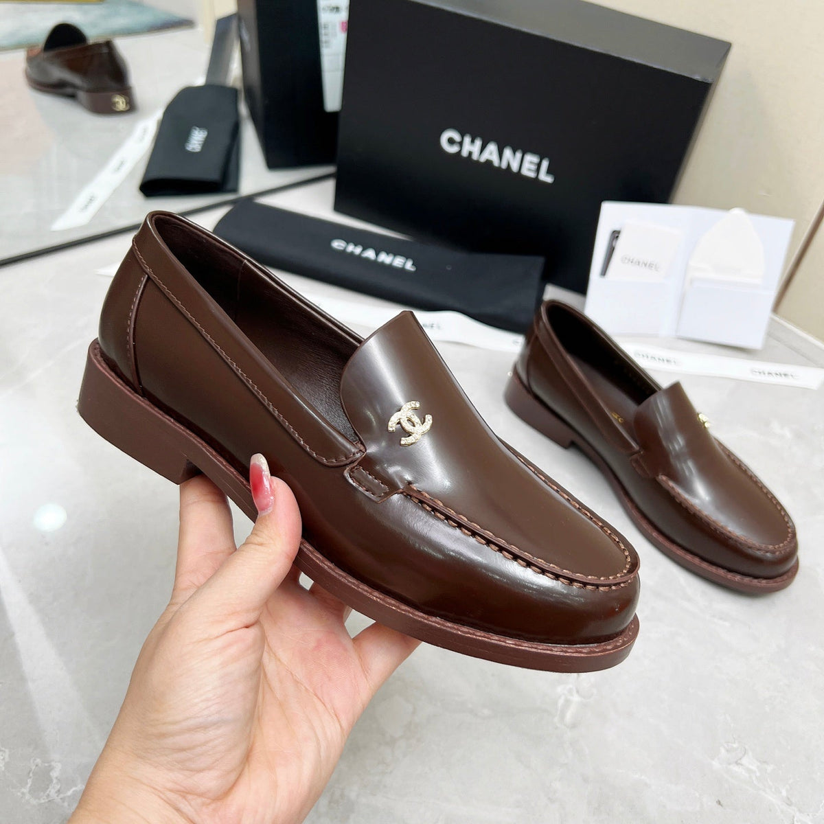 CHANEL MOASINS IN BROWN CALFSKIN