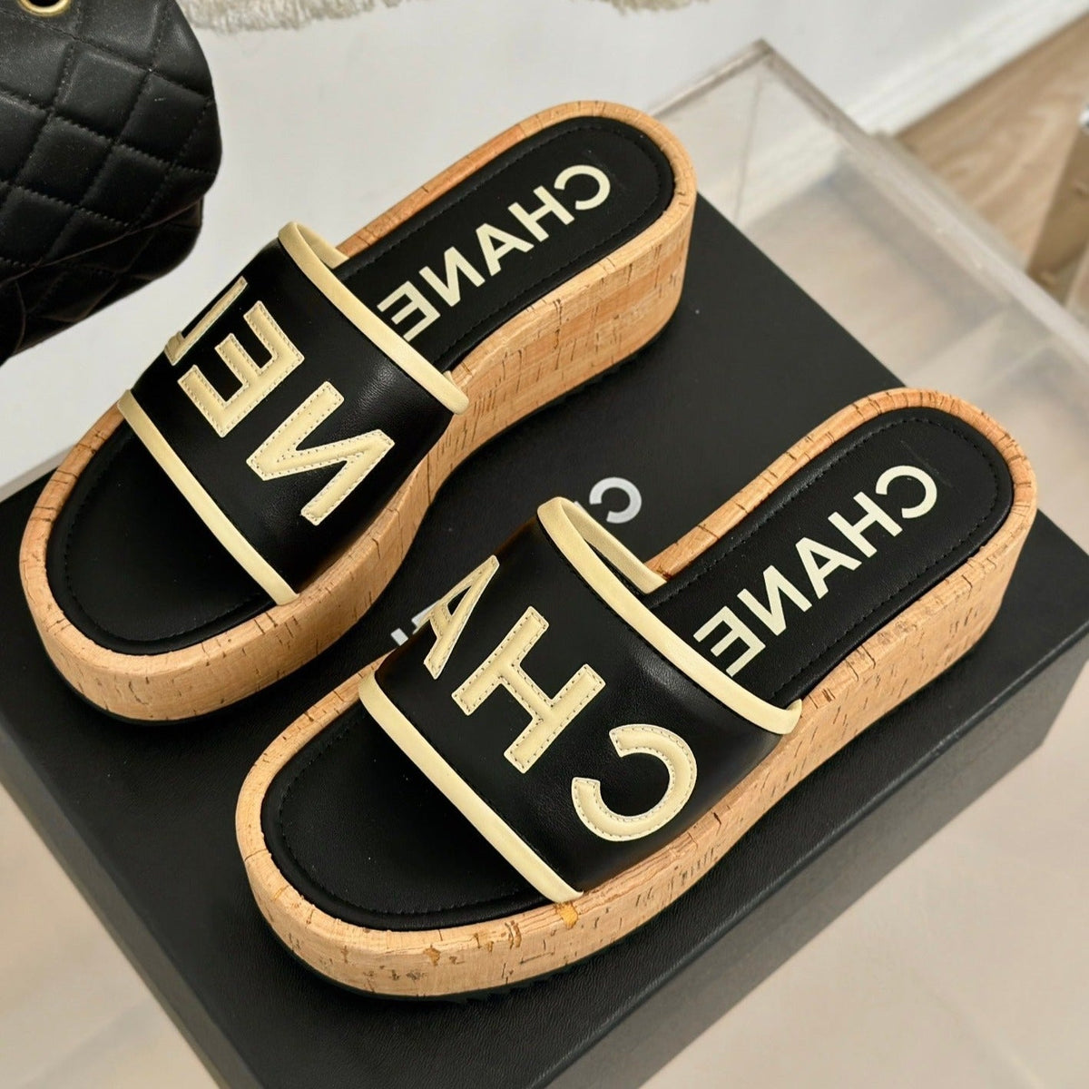 CHANEL THICK SOLE LETTER SLIPPERS IN BLACK SHEEPSKIN